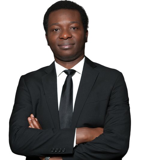 Dapo Bankole, founder of Mentorfy, in a dark suit with arms folded